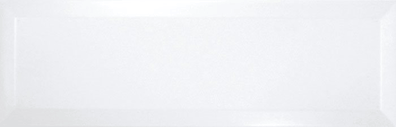 Carrelage uni blanc légèrement texturé de dimensions 10x30 cm.