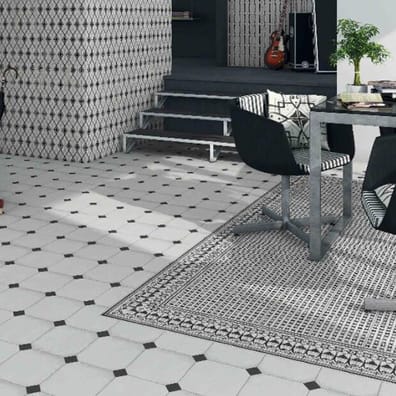 Carrelage uni multicouleur 20x20 cm dans une salle à manger avec mobilier contemporain et touches de rouge