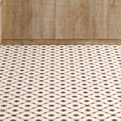 Carreau de ciment rouge avec motifs étoilés 30x30 cm dans une cuisine sur fond beige avec revêtements muraux en bois clair