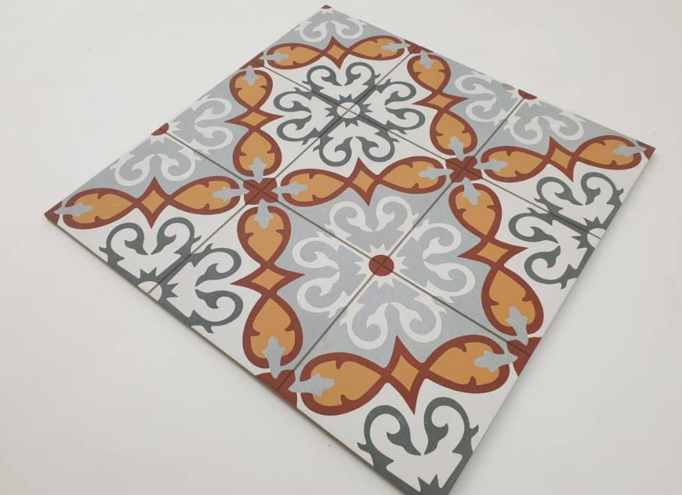 Carreau de ciment multicouleur avec motifs floraux et géométriques en orange, gris et blanc, taille 60x60 cm