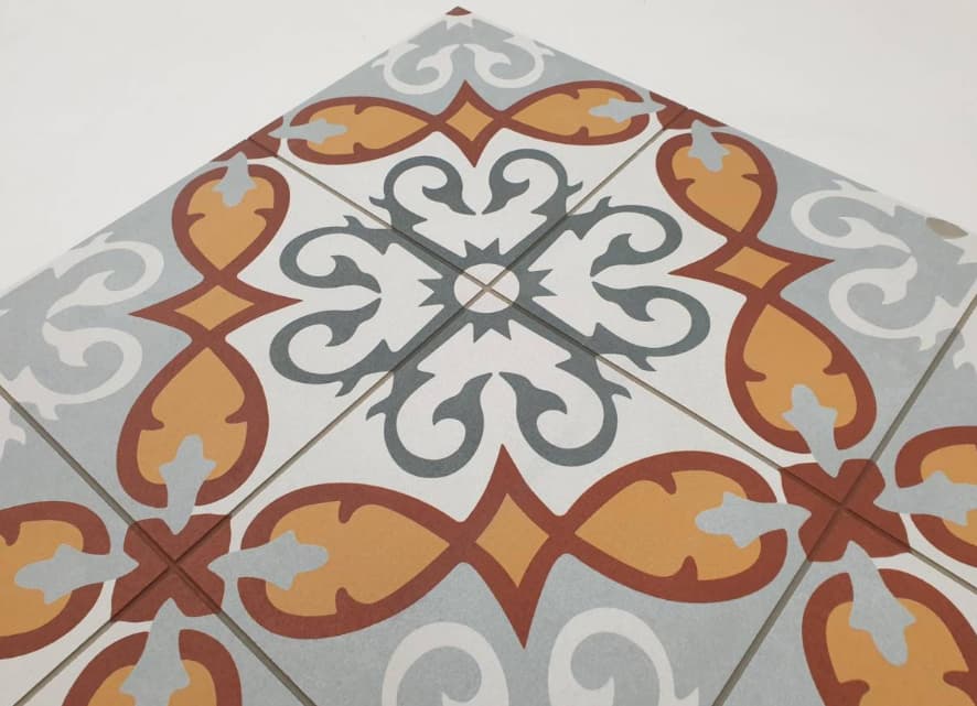 Carreau de ciment multicouleur avec motifs floraux et géométriques en marron, orange et gris, taille 60x60 cm