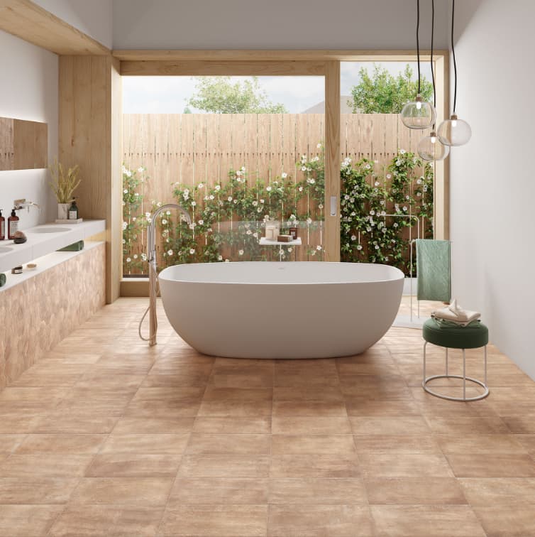 Carrelage terre cuite blanc 20x20 cm dans une salle de bain tons bois clair et blanc, avec baignoire ovale et détails verts