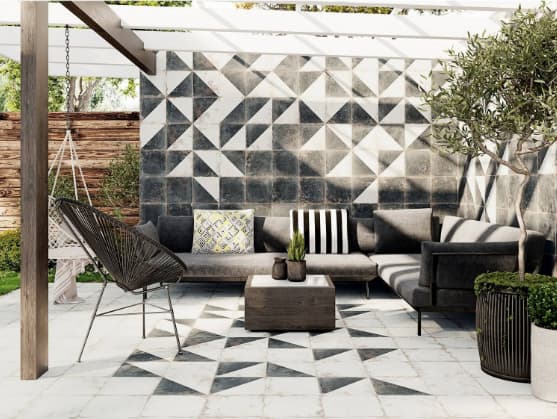 Carreau de ciment blanc avec motifs géométriques gris 30x30 cm dans une terrasse extérieure couleurs neutres avec mobilier dextérieur moderne