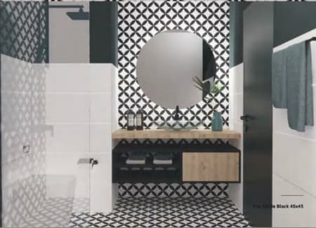 Carreau de ciment noir motifs géométriques blancs 20x20 cm dans une salle de bain contemporaine aux murs blancs avec meuble en bois et miroir rond