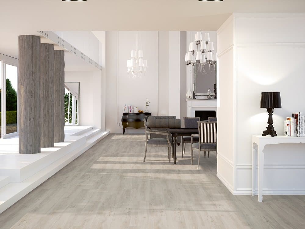Carrelage effet bois gris clair 20x120 cm dans un salon épuré blanc avec mobilier élégant et détails modernes