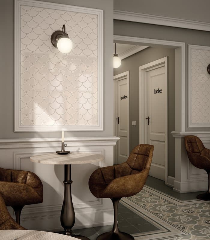 Carrelage uni beige sur une salle dattente aux murs gris, mobilier brun, sol contrastant avec motifs géométriques verts