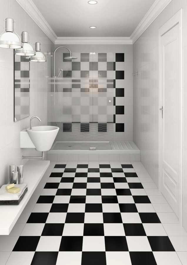 Carrelage uni noir et blanc dans une salle de bains moderne avec des murs gris, sanitaires blancs et éclairage design