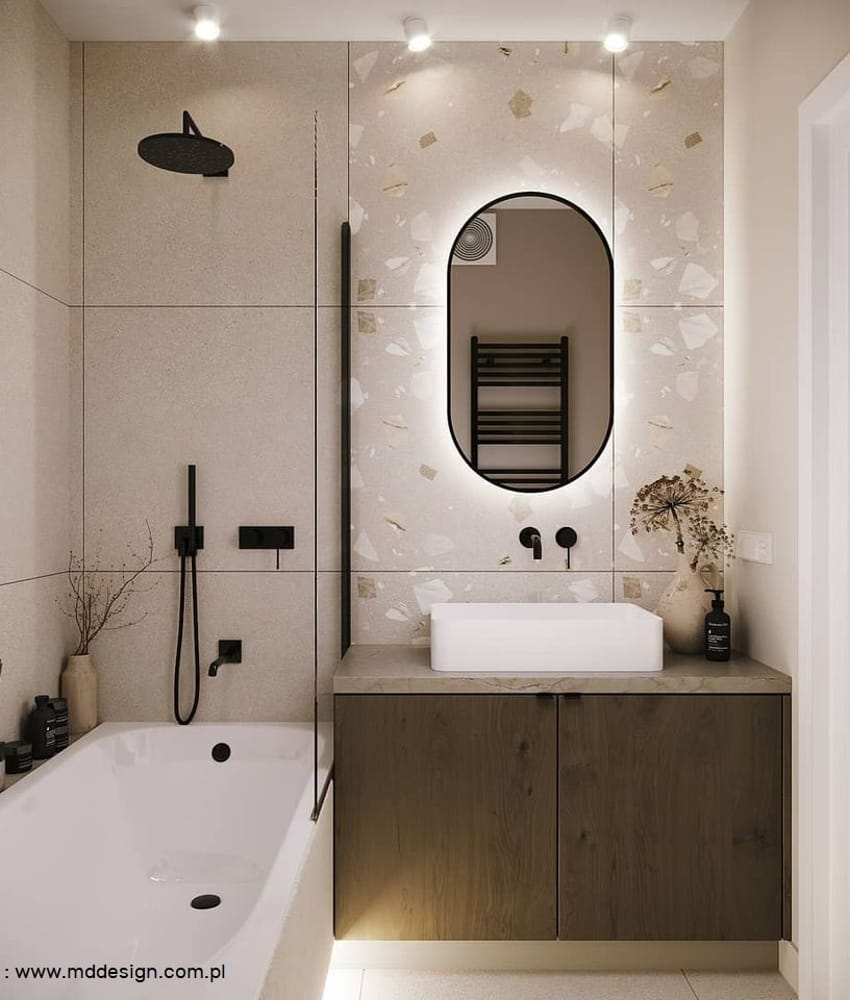 Carrelage Terrazzo beige avec éclats de marbre 80x80 cm dans une salle de bain tons bois et blanc avec vasque, miroir ovale, bai