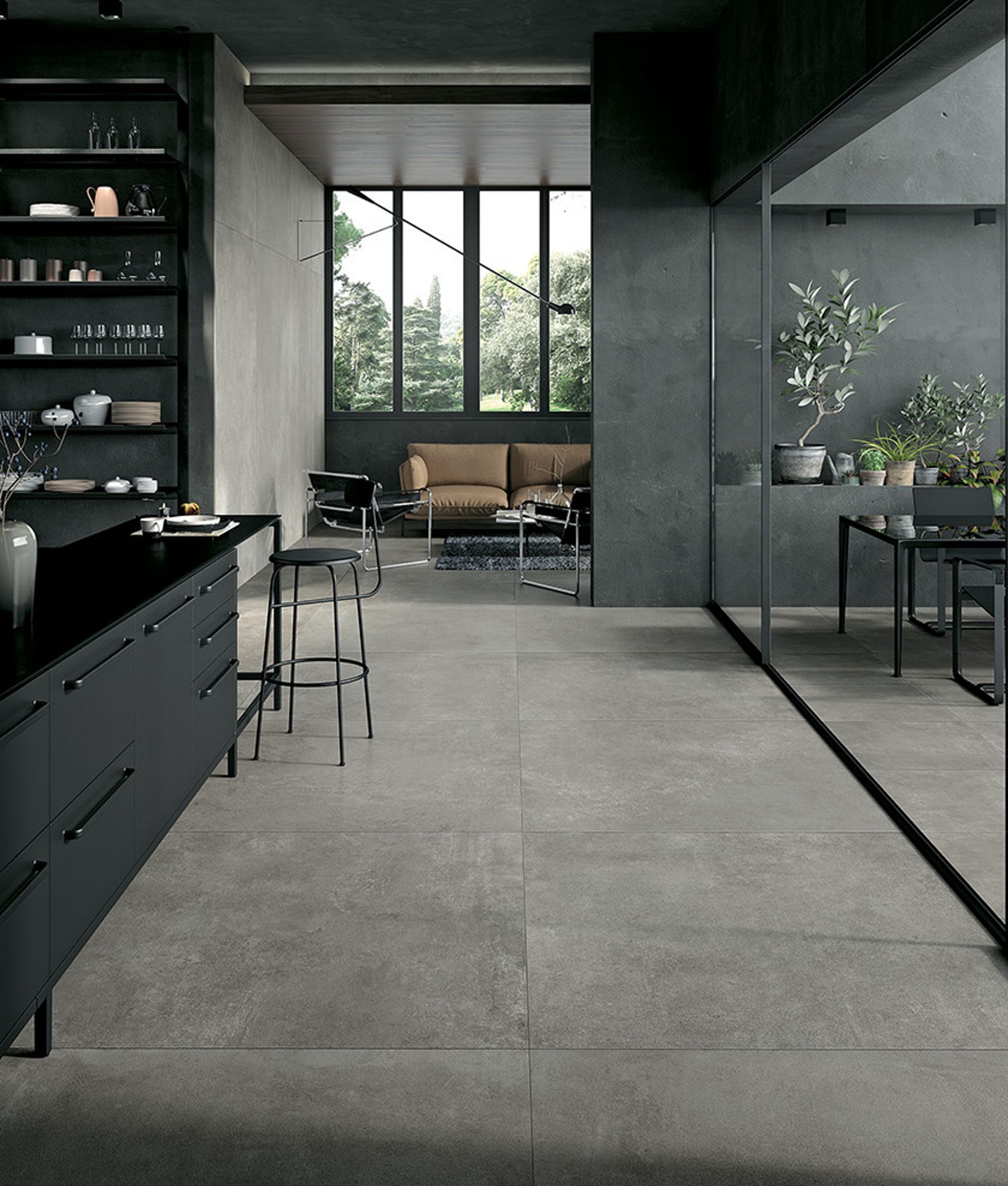 Carrelage effet pierre gris nuances subtiles 60x60 cm dans une cuisine moderne tonalités sombres meubles noir et éléments décora